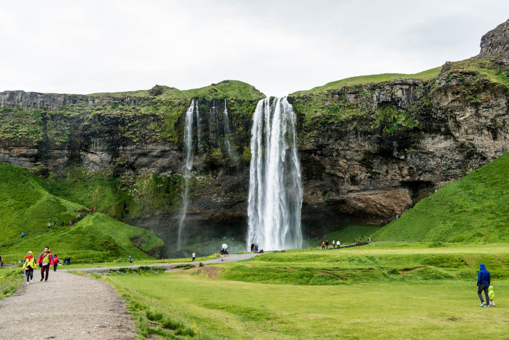 Seljalandsfoss derives from the river Seljalandsá drops 60 metres (200 ft) over the cliffs of the former coastline